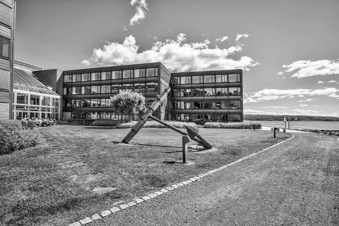 The office building at Strandveien 50, Lysaker, with the anchor on the lawn